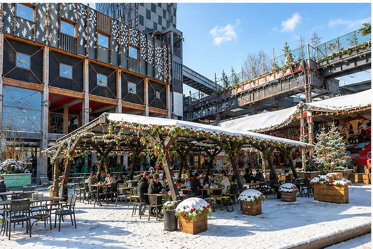 Snow-dusted, garland-wrapped seating pergola at the Freight Island Christmas Village on a bright winter day.
