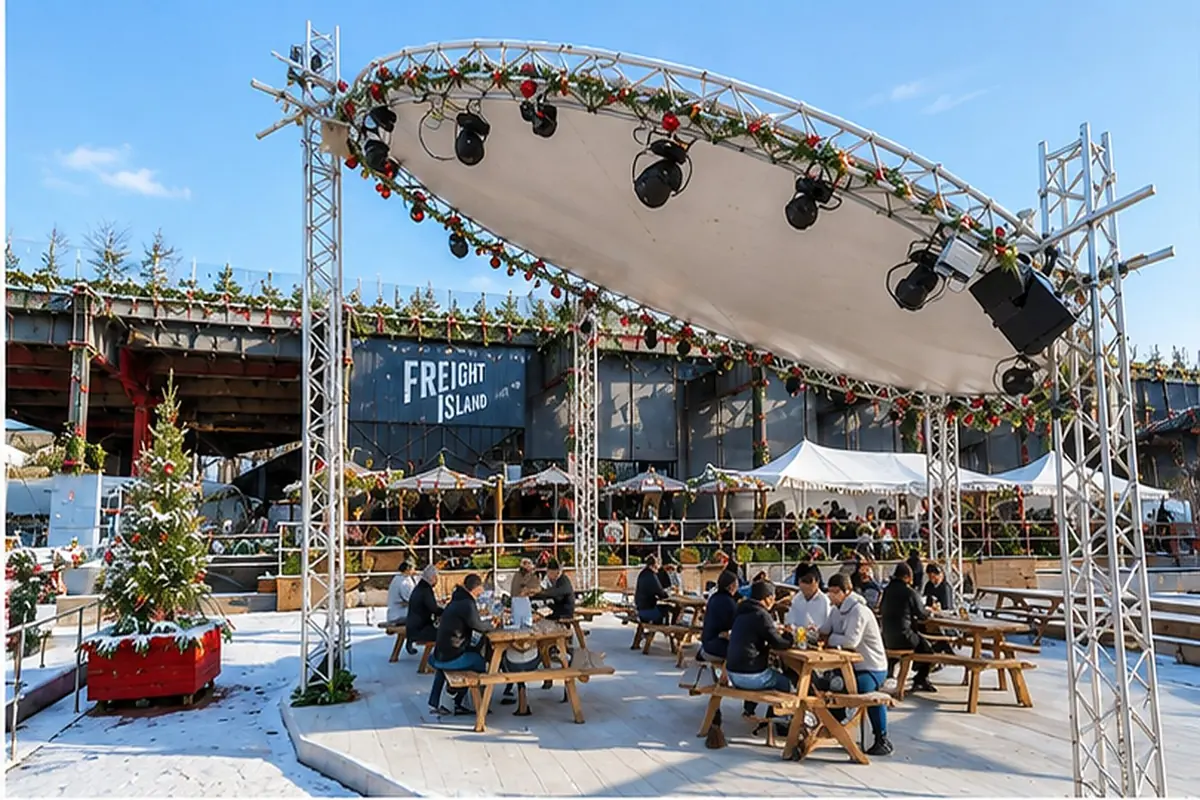 The Freight Island stage decked out for Christmas under a clear blue winter sky.